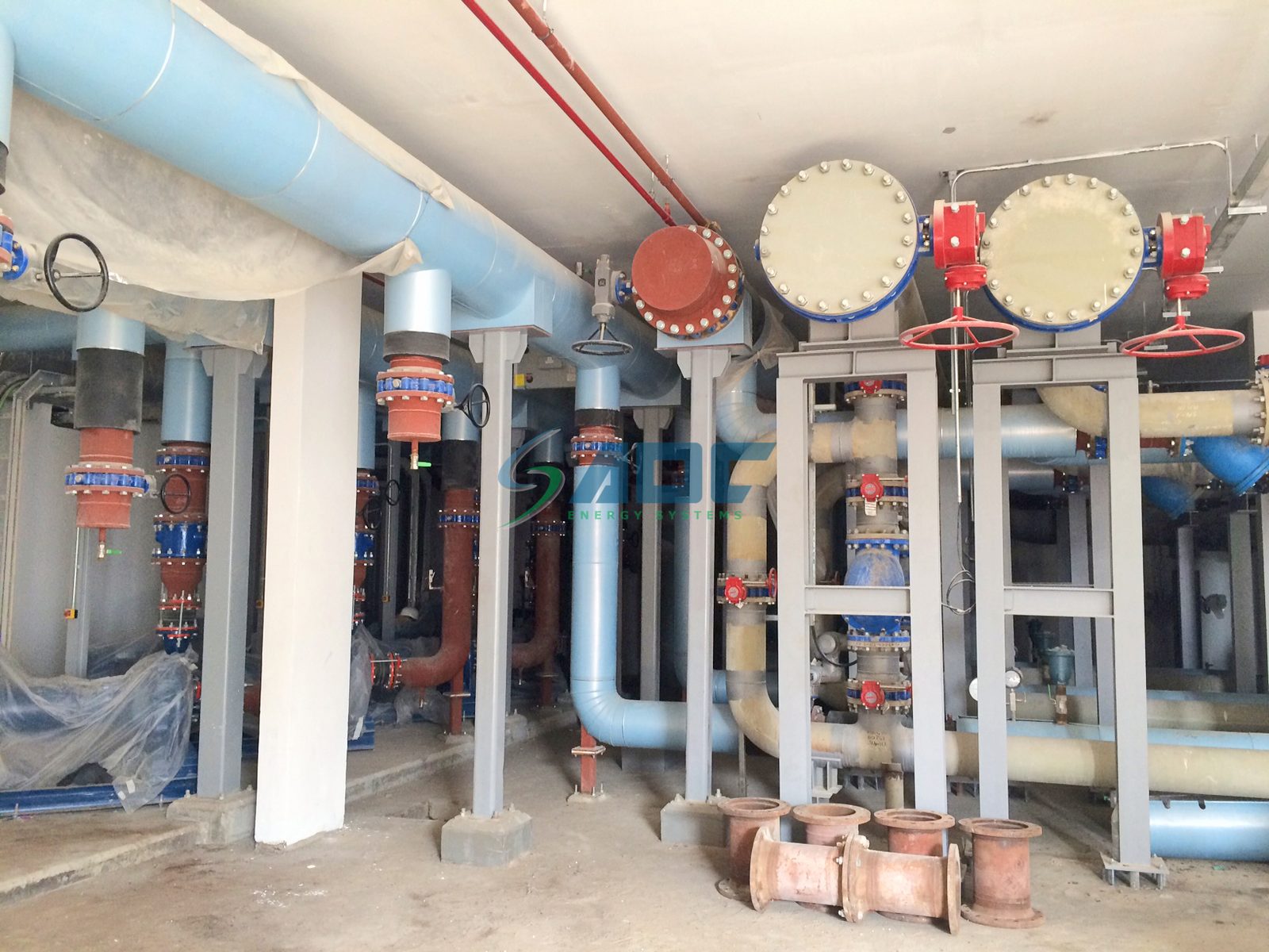 Chilled-water network piping and valves at Dubai Parks & Resorts